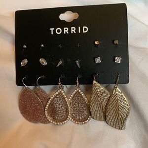 Torrid 8 pairs of earrings. 5 pairs of studs. And 3 pairs of sparkly dangling.